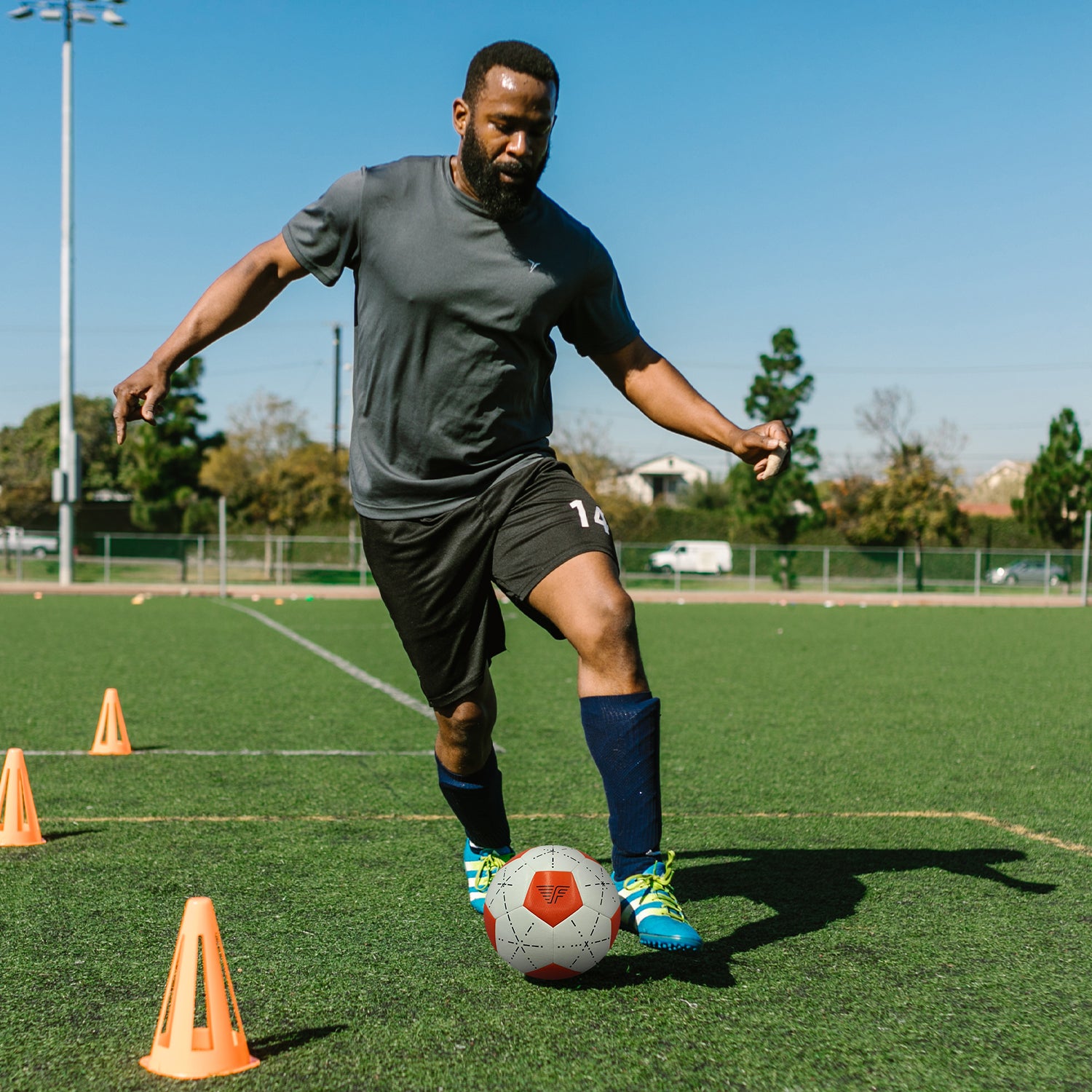 Man training with a Flynn football
